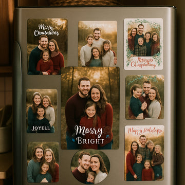 A cozy kitchen fridge door covered with a collection of family portrait holiday photo magnets, showing different sizes and festive designs. Alt: Family portrait holiday photo magnets displayed on a fridge