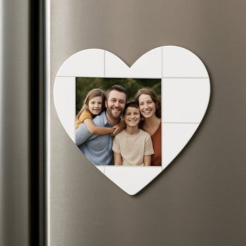 A heart‑shaped photo magnet on a kitchen fridge, showing a family photo and a simple layout grid. Alt: heart shaped photo magnets displayed on a refrigerator